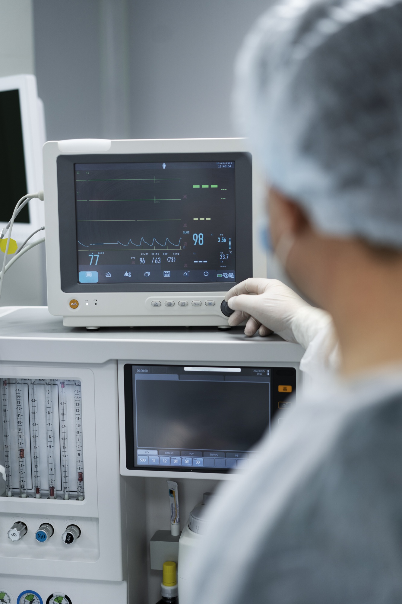 doctor monitoring patient s pulse